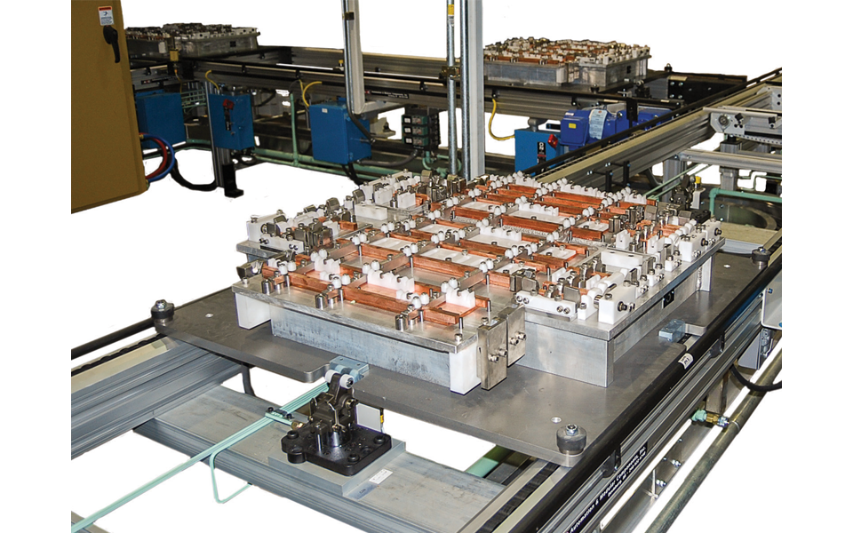 Automated conveyor line transporting dishwasher components